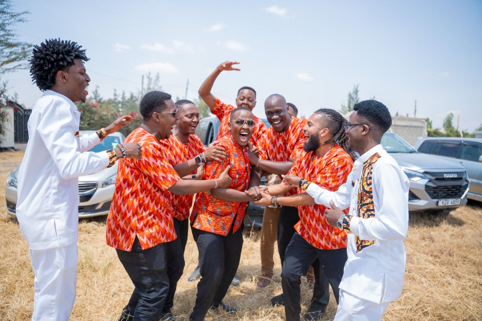 Melvyn celebrating with his groomsmen