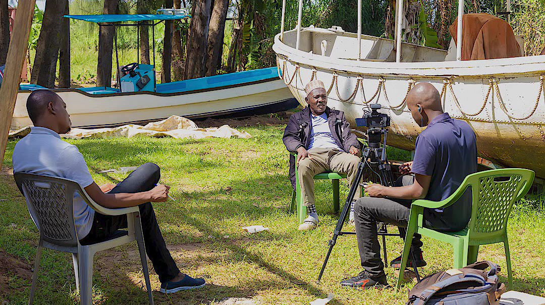 Skylit filming a KEMFSED interview by the boats