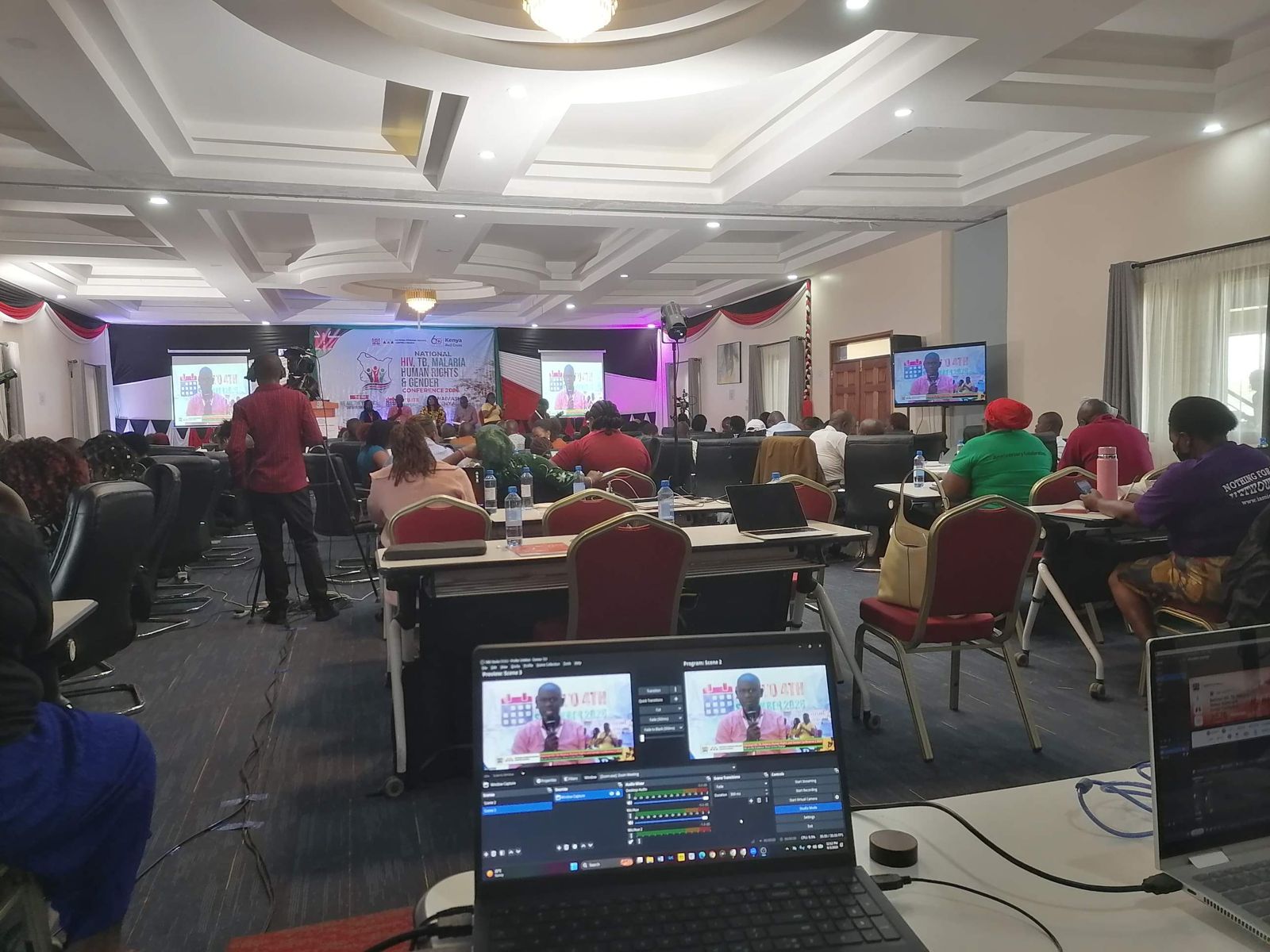 Conference screens fed live from the Skylit desk